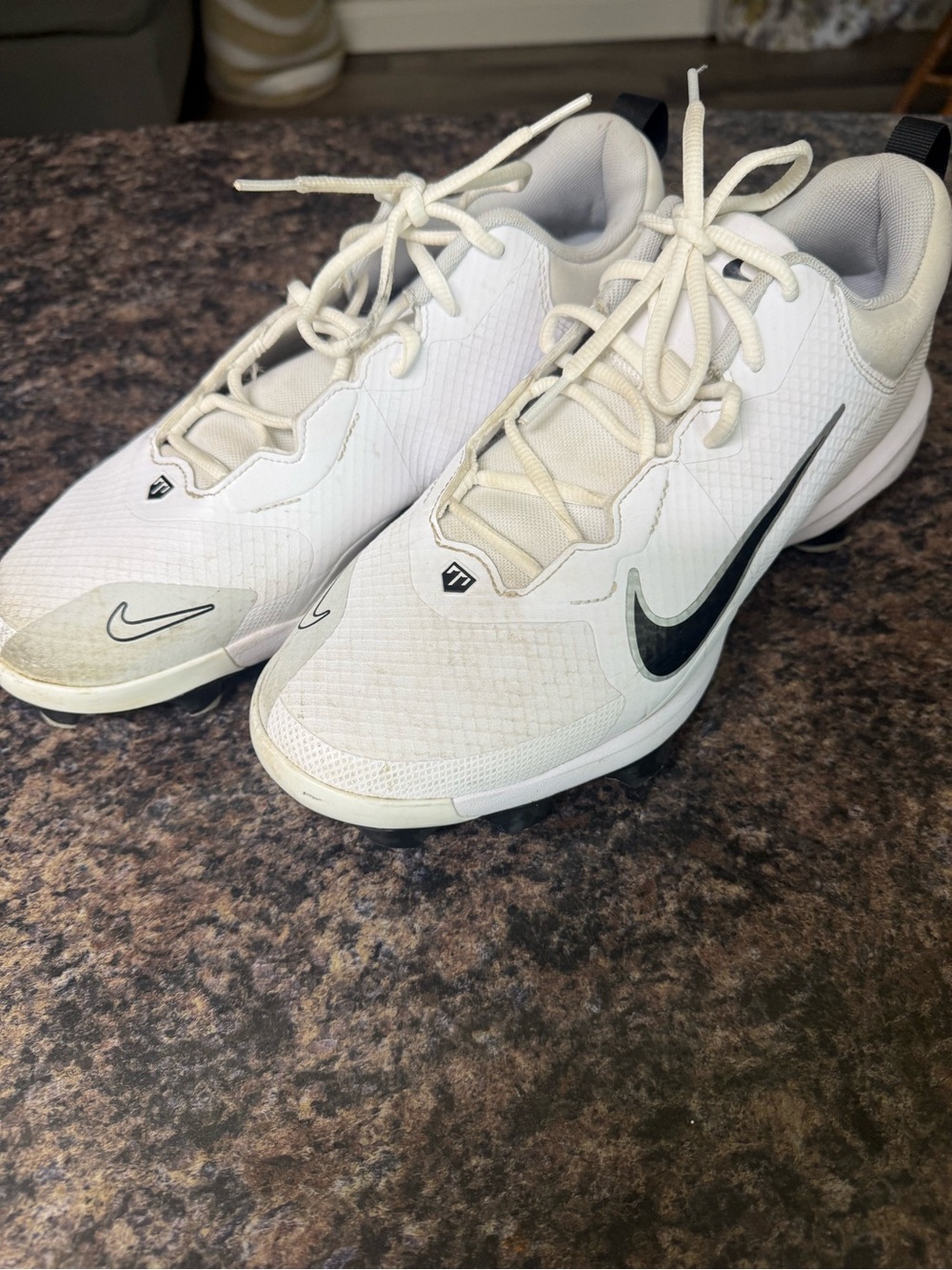 Nike Men’s White Athletic Cleats with Black Swoosh